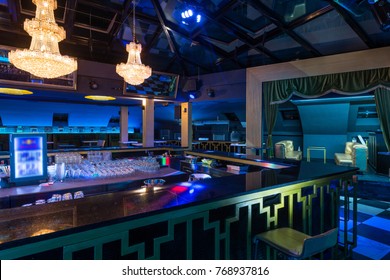 Chandeliers Skylight And Empty Bar Counter In Restaurant Interior