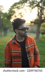 Chandigarh, Chandigarh India - 10 04 2022 : A Man Wearing Orange Jacket Posing In Park