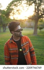 Chandigarh, Chandigarh India - 10 04 2022 : A Man Wearing Orange Jacket Posing In Park