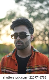 Chandigarh, Chandigarh India - 10 04 2022 : A Man Wearing Orange Jacket Posing In Park