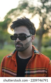 Chandigarh, Chandigarh India - 10 04 2022 : A Man Wearing Orange Jacket Posing In Park