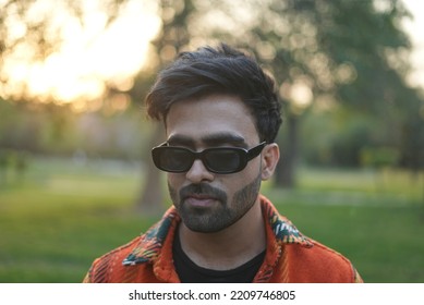 Chandigarh, Chandigarh India - 10 04 2022 : A Man Wearing Orange Jacket Posing In Park