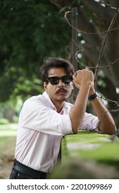 Chandigarh, Chandigarh India - 12 08 2022 : Young Man Posing With Brick Wall Wearing Pink Shirt And Apple Watch