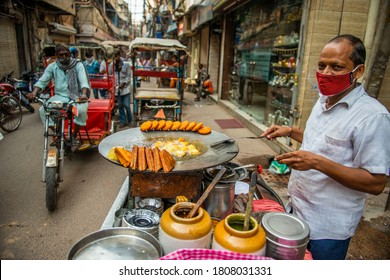 Chandni Chowk, Delhi/India - Sep 2 2020 , Man With Mask Making Street Food Aloo Chaat  At Kinari Bazar.