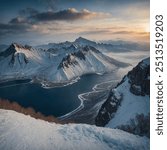 Changbai Mountain, located on the border between China and North Korea, is a majestic volcanic mountain range renowned for its stunning natural beauty. The area features a dramatic landscape.