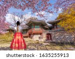 Changdeokgung Palace with Korean national dress and cherry blossom in spring,South Korea