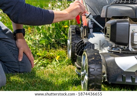 change and check the oil in the motor lawn mower