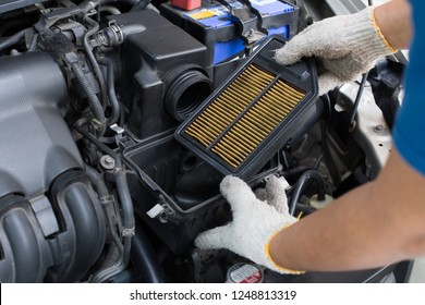 change dirty air filter over a car engine during general auto maintenance