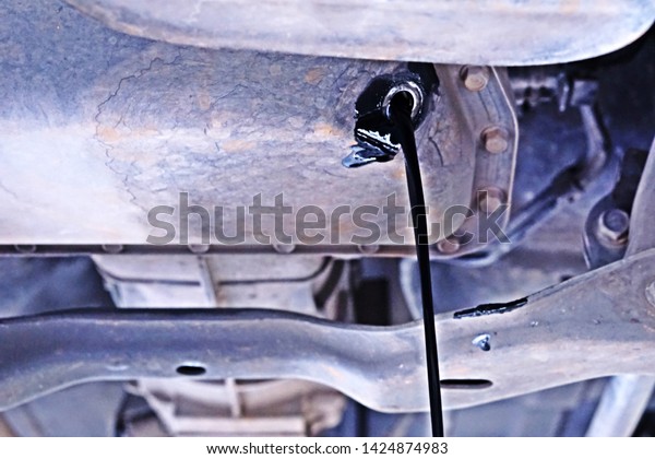 Change engine oil from\
under the engine