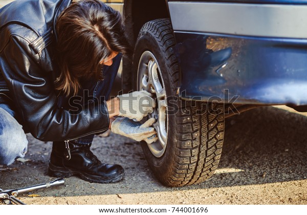 Change a flat car tire on road with Tire
maintenance, damaged car
tyre