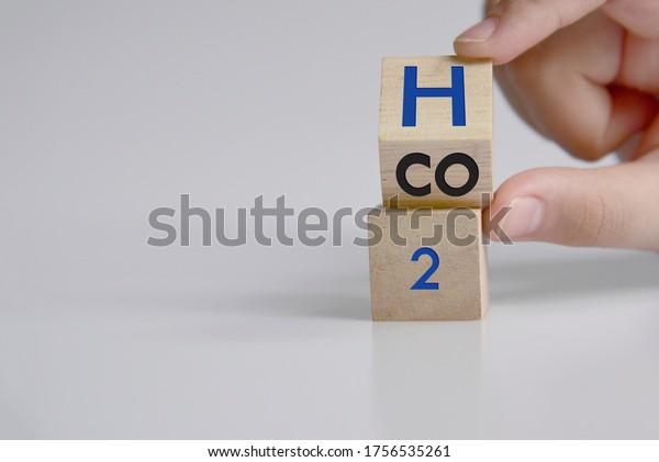 Change to fuel cell vehicles. Hand flips a dice\
and changes the expression CO2 to\
H2