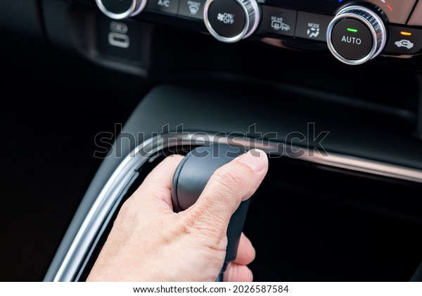 Change gear with the\
shift lever of the car
