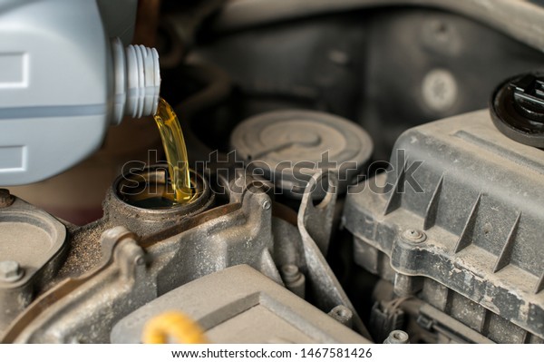 Change the Oil , close up selective focus,\
car engine oil change, engine\
maintenance
