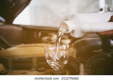Change the Oil ,  flushing oil,close up selective focus Refueling and pouring oil quality into the engine motor car Transmission and Maintenance Gear .Energy fuel concept. - Shutterstock ID 2112796682