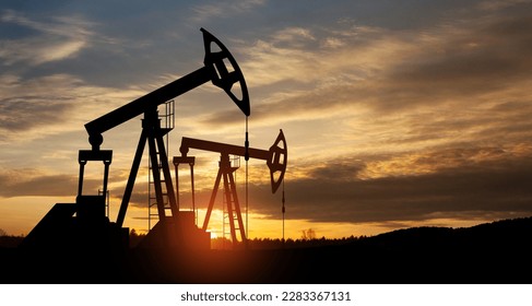The change in oil prices caused by the war. Oil price cap concept. Oil drilling derricks at desert oilfield. Crude oil production from the ground. Petroleum production. - Shutterstock ID 2283367131
