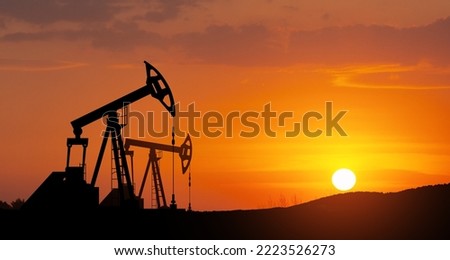 The change in oil prices caused by the war. Oil prices are rising because of the global crisis. Oil drilling derricks at desert oilfield. Crude oil production from the ground. Petroleum production.