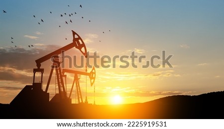 The change in oil prices caused by the war. Oil prices are rising because of the global crisis. Oil drilling derricks at desert oilfield. Crude oil production from the ground. Petroleum production.