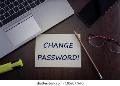 Change password card. Top view of office table desktop background with laptop, phone, glasses and pencil with card with inscription change password.  Internet security concept.