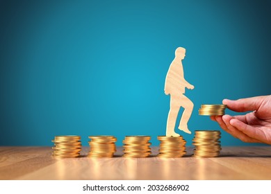 Change return on investment, growing savings or wage income concept. Wooden person is going from constant bucket of coins to growing coins. Successful investment concept. - Shutterstock ID 2032686902