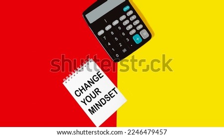 Change the symbol of your thinking. Concept words Change your mindset on wooden blocks. Beautiful red and yellow background.