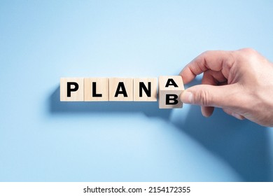 Change the wooden cube block word from Plan A to Plan B concept for strategy, change, alternative and perseverance