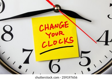 Change Your Clocks On Post-it Stuck To A Wall Clock