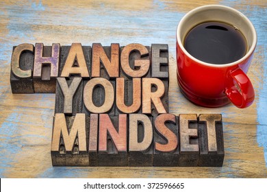 change your mindset - motivational text in vintage letterpress wood type printing blocks stained by color inks with a cup of coffee - Shutterstock ID 372596665