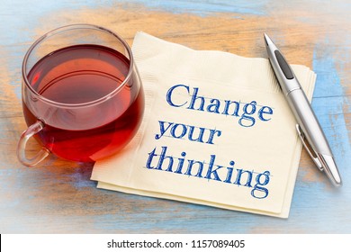 Change your thinking advice - handwriting on a napkin with a cup of tea - Shutterstock ID 1157089405