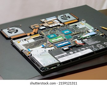 Changes Thermal Grease Of Laptop Computers. Applying Thermal Paste To The GPU And CPU. Cooling Upgrade Concept.