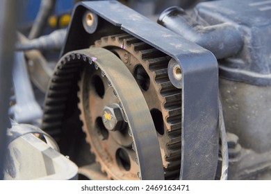 changes the timing belt in the car, remove a worn timing belt on a car engine, car repair