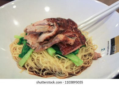 CHANGI AIRPORT SEPTEMBER 2014 - Noodle And Duck Roasted Are Served In A White Bowl With A Chopstick In Kopi Tiam Food Court Changi Singapore