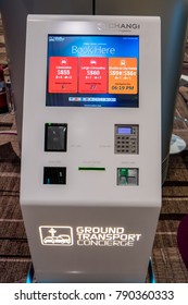 Changi, Singapore / Singapore - Jan 9th 2018: An Unmanned Ground Transport Concierge Kiosk At Changi Airport's Terminal 4, Where Tourists Can Self Book For Transportation From Airport To The City 