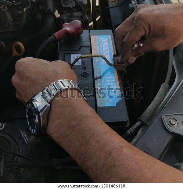 Changing the battery of a car at Ranau, Sabah,\
Malaysia on the September 9,\
2019.
