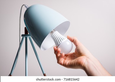 Changing The Bulb For Led Bulb In Table Lamp In Turquoise Colours.