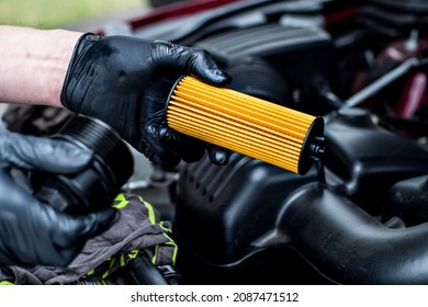 Changing Car Oil Filter. DIY Change Engine Motor Oil. At Home Vehicle Maintenance. Oil Filter Replacement. New Oil Filter