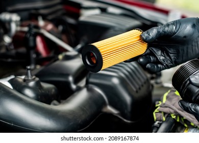 Changing car oil filter. DIY change engine motor oil. At home vehicle maintenance. Oil Filter replacement. New Oil filter