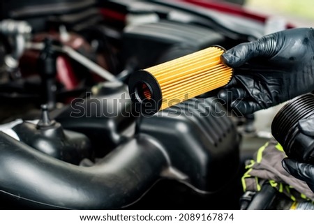 Changing car oil filter. DIY change engine motor oil. At home vehicle maintenance. Oil Filter replacement. New Oil filter
