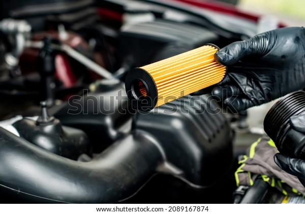 Changing car oil filter. DIY change engine motor\
oil. At home vehicle maintenance. Oil Filter replacement. New Oil\
filter