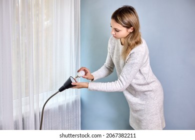 Changing Lamps In Floor Lamp By Slim Woman In Bedroom. Female Changes Light Bulb.