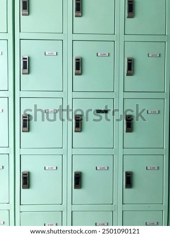 Changing locker on the pool. School lockers with open doors and sports equipment, items and accessories for sports.