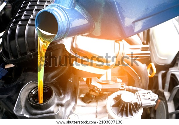 Changing oil and adding quality oil\
and oil standards into the car engine for maintenance Transmission\
and Maintenance Gear .Energy fuel concept.soft\
focus