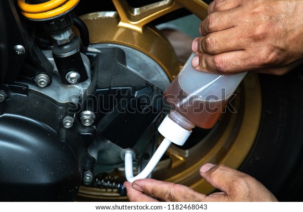 Changing the oil on a\
motorcycle