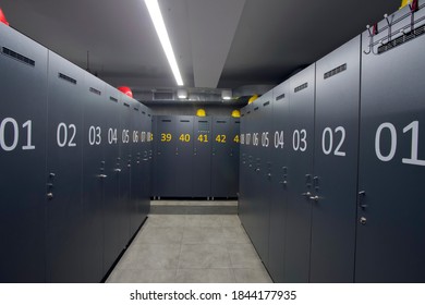 changing room for factory workers hard hat on numbered cabinets - Powered by Shutterstock