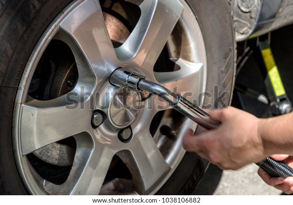 changing the tires of a car from  winter tires to\
summer tires in spring