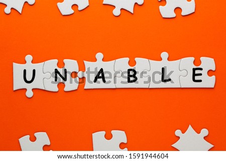 Changing word unable transformed to able on puzzle. Business concept.