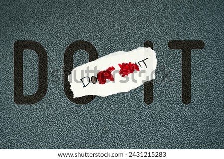 Changing the words Don't Quit to Do It with red pen in a motivational message about hope and perseverance.