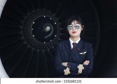 Changshui international airport in kunming, southwest China's yunnan province, March 5, 2019. The female pilot filmed in front of the plane's turbine