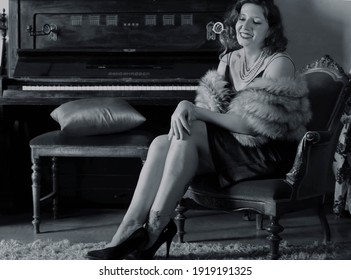 Chania, Greece, 1 05 2020: vintage photoshoot, a lady having fun in her leaving room with a piano background