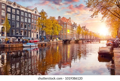 Channel in Amsterdam Netherlands houses river Amstel landmark old european city spring landscape.