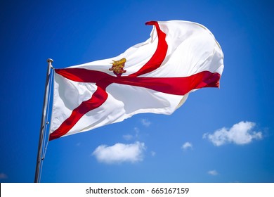 Channel Islands Jersey flag against blue sky